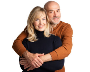 A couple smiling with healthy teeth